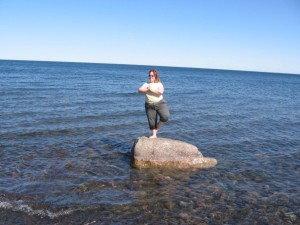 Doing tree pose on a rock in Lake Superior, 2006